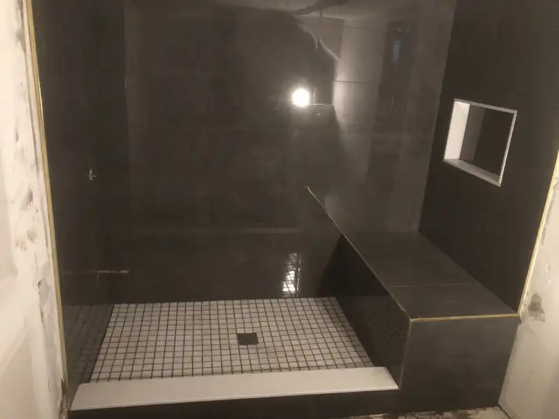 Wide view of a tile floor installation in a sunlit room