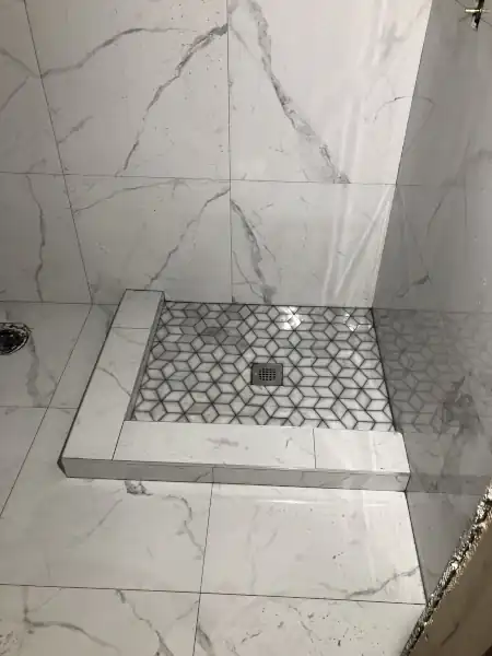 Marble mosaic tile shower floor pattern, installation in progress